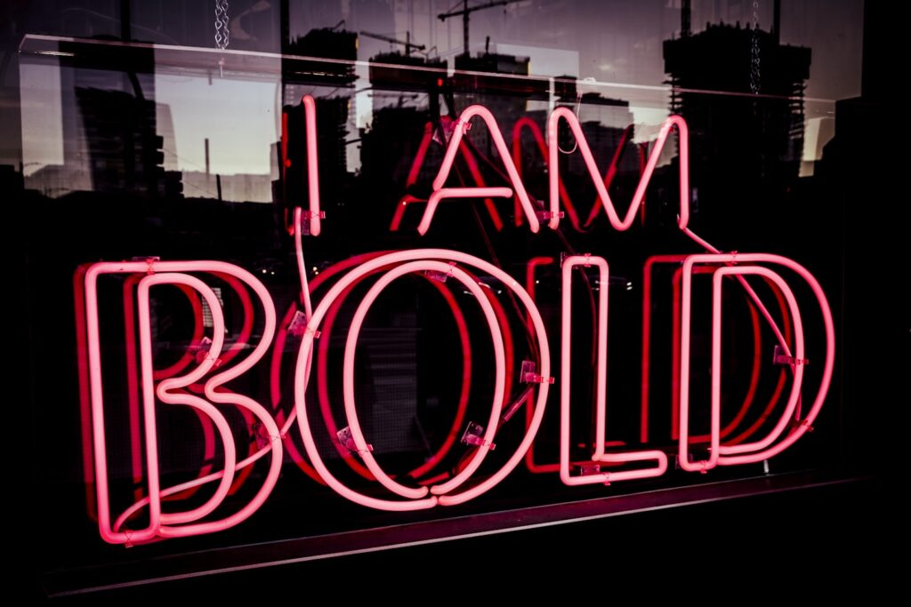 A sign that says I AM BOLD to describe Christian women of faith pursuing their God-given gifts, God-given talents, and God-given purpose.